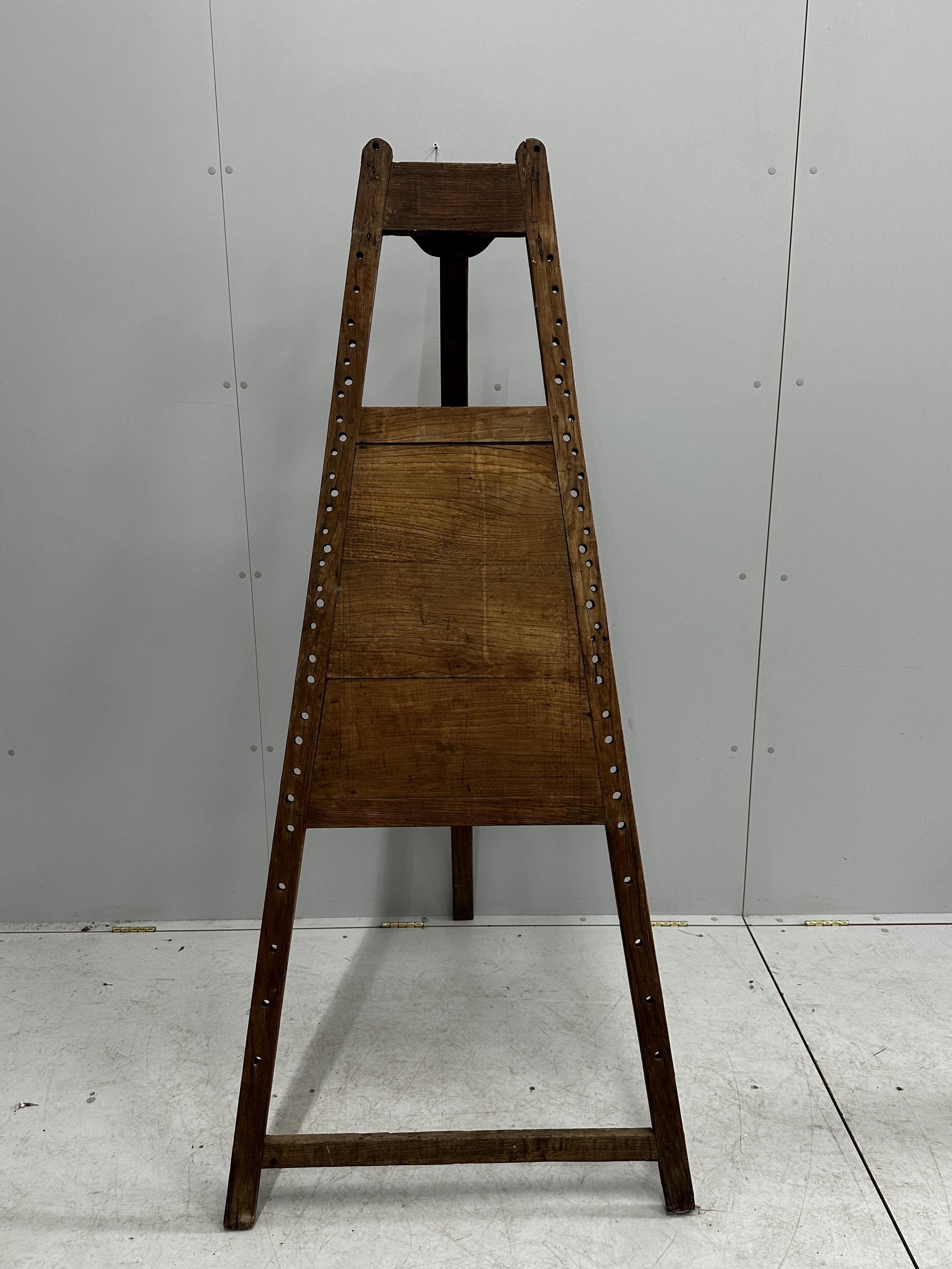 A 19th century French provincial fruitwood easel, height 177cm